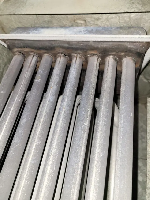 Close-up of furnace heat exchanger tubes during an inspection